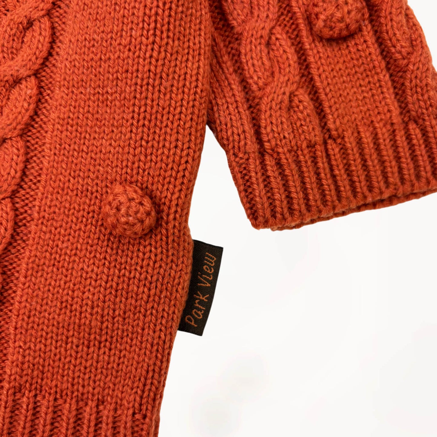 Gebreide gilet roest oranje, kabeltrui met pompoms ⎪68